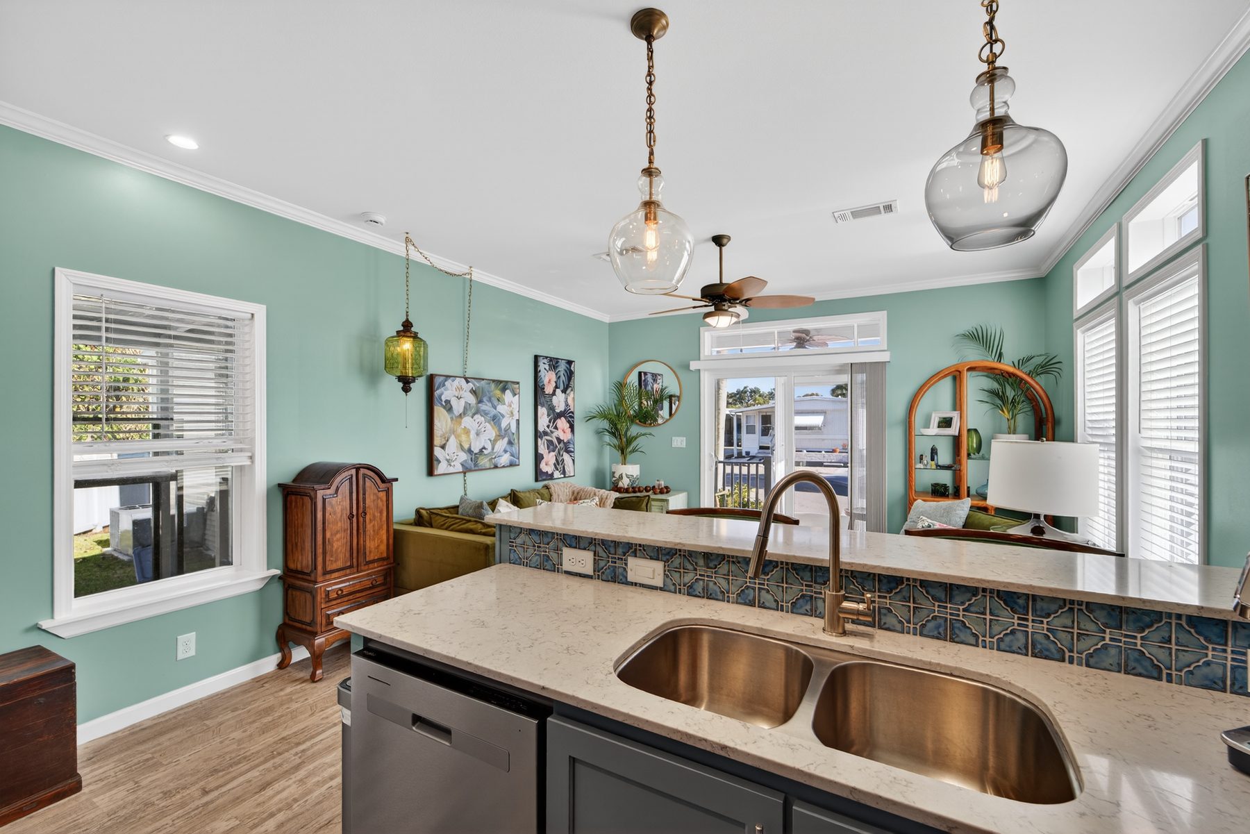 Kitchen island with double sink and pendant lighting