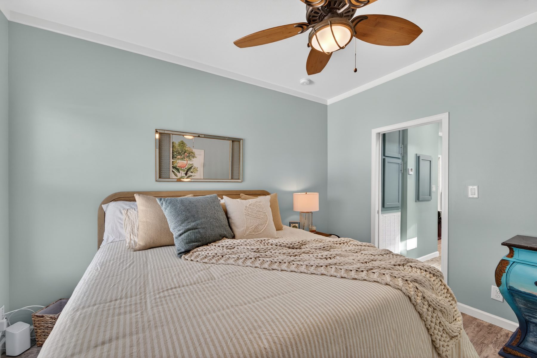 Primary bedroom with sage walls and ensuite bath