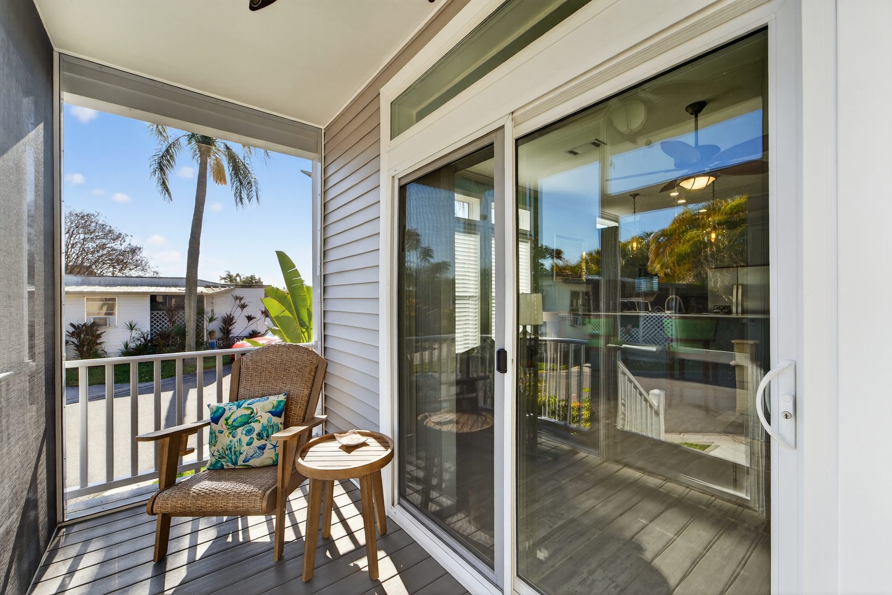 Screened front porch with palm view